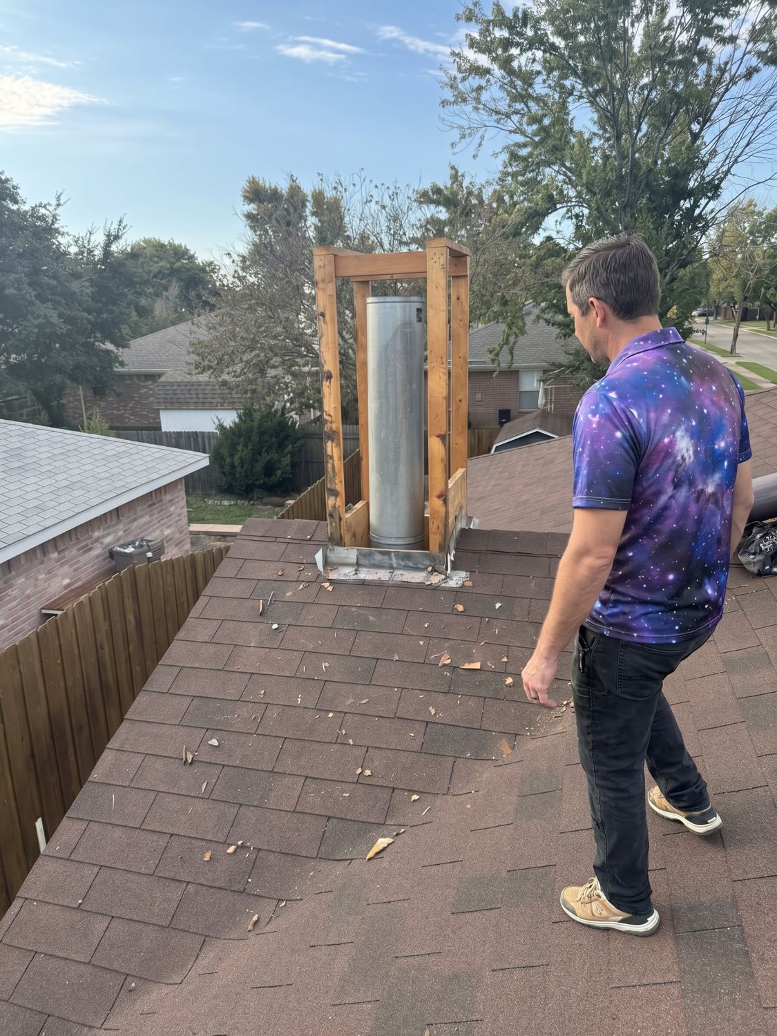 Space technician reviewing an opened chimney chase