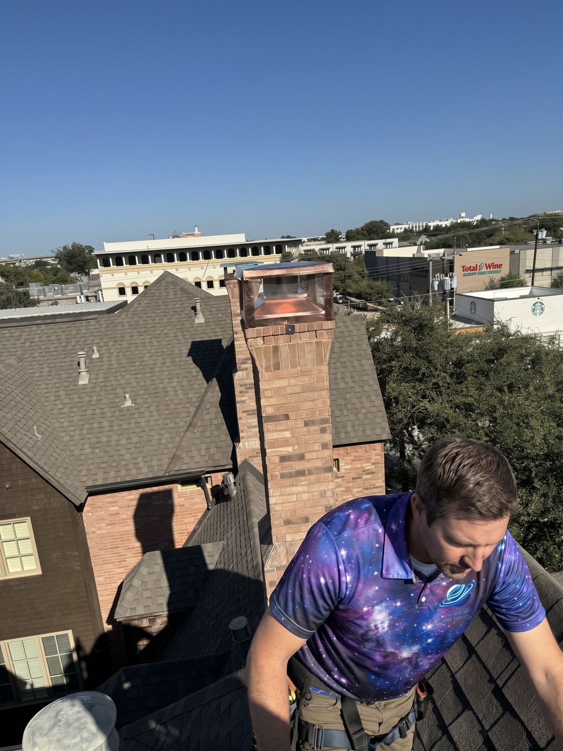 Space technician next to a chimney with a new copper cap