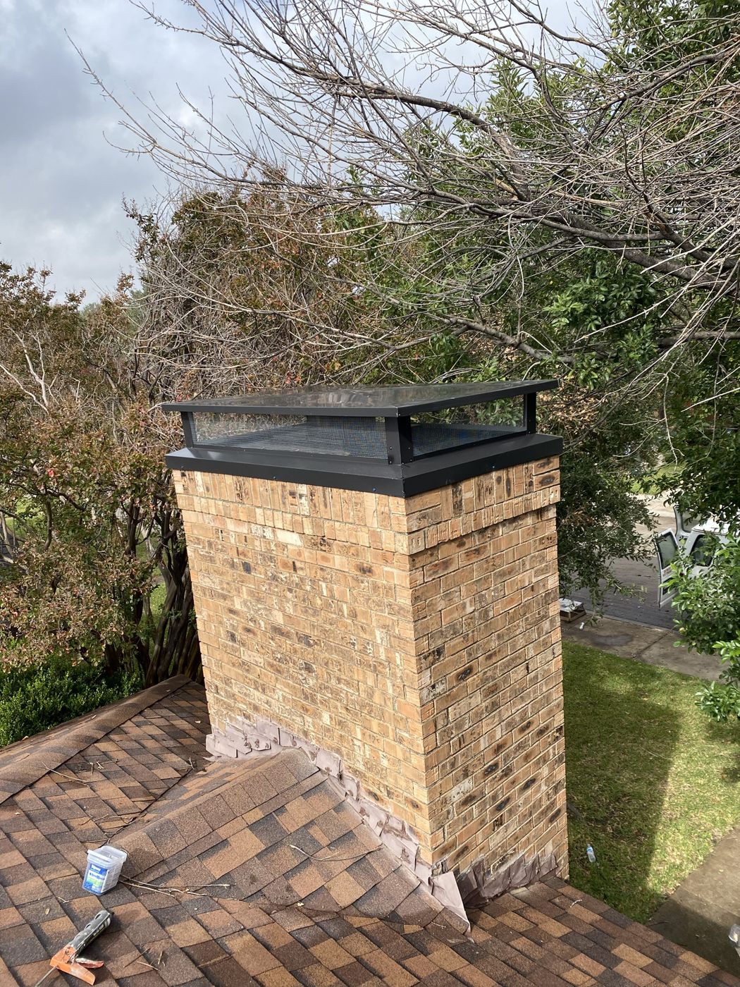 New chimney cap installed by Space on a brick chimney