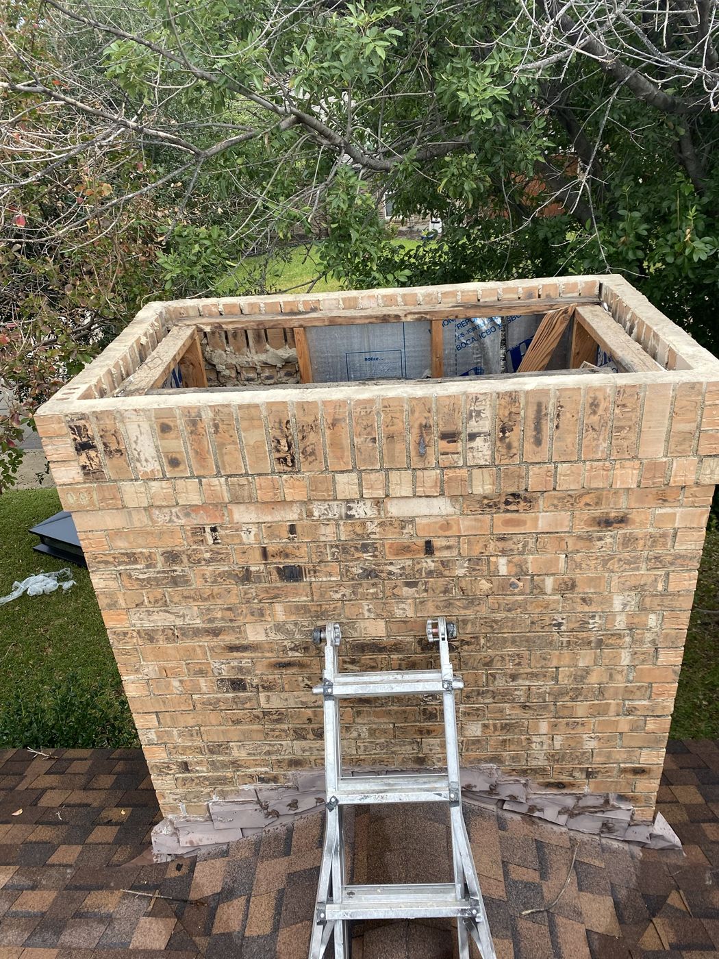 Rotted framing inside a chimney chase